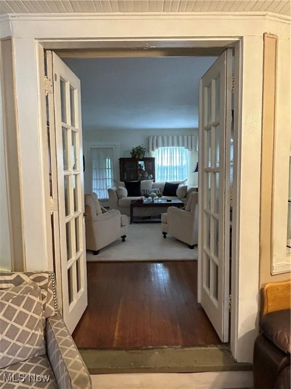 living room with wood-type flooring and french doors