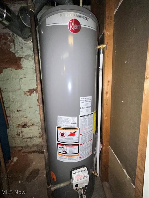 utility room with gas water heater