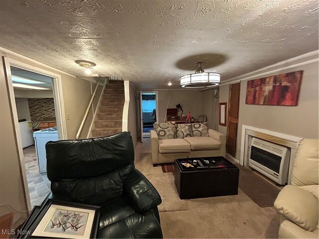 carpeted living room featuring heating unit and a textured ceiling