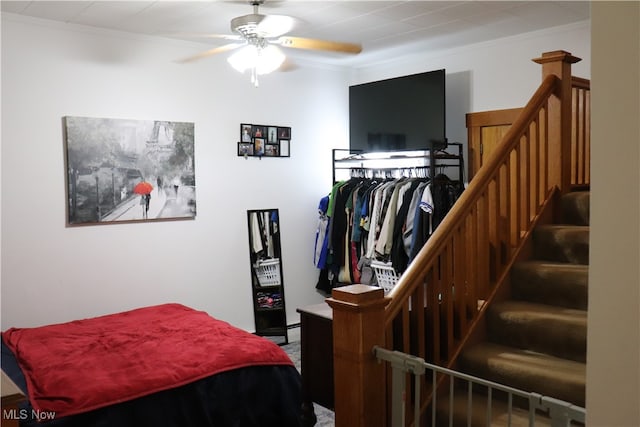 bedroom featuring crown molding and ceiling fan