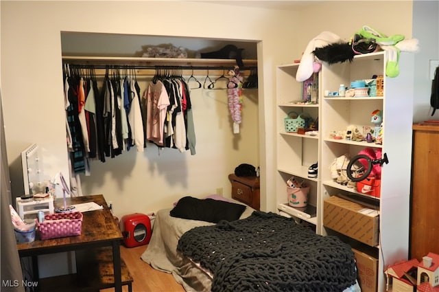 bedroom with hardwood / wood-style floors