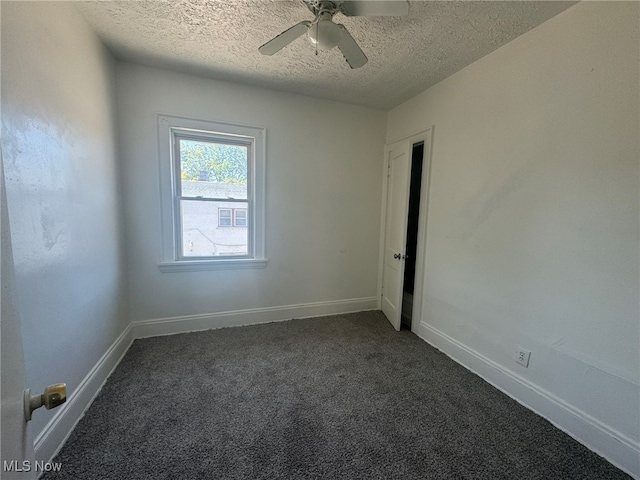 carpeted empty room with a textured ceiling and ceiling fan