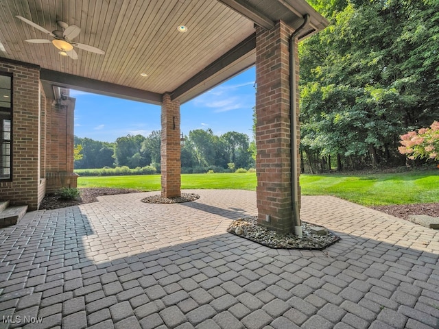 view of patio featuring ceiling fan