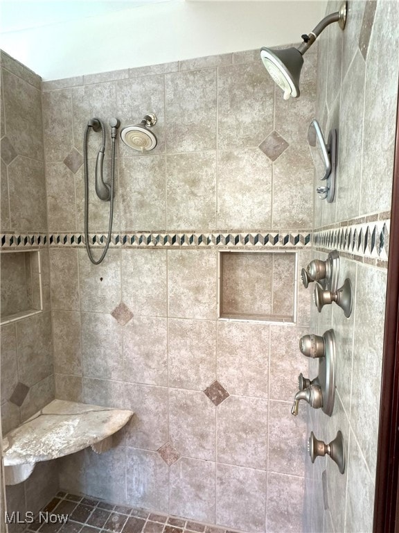 bathroom featuring a tile shower