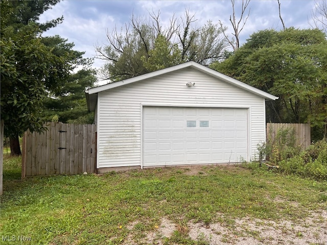 garage with a lawn