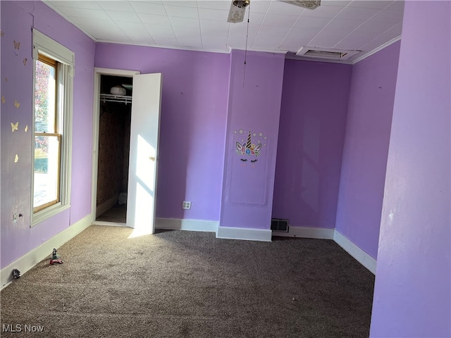 unfurnished bedroom featuring carpet, visible vents, and baseboards