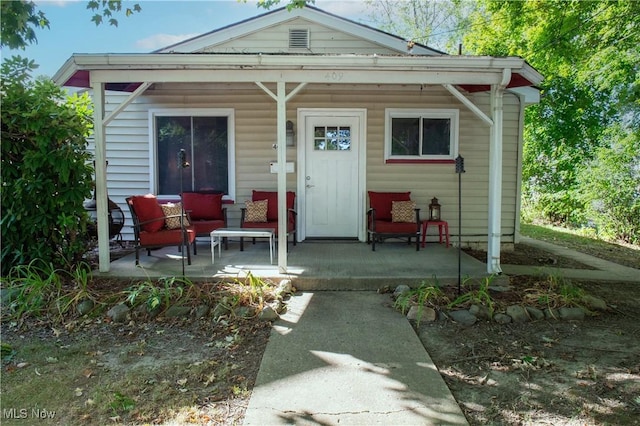 back of house with a porch