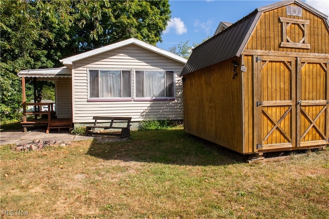 view of outbuilding with a yard