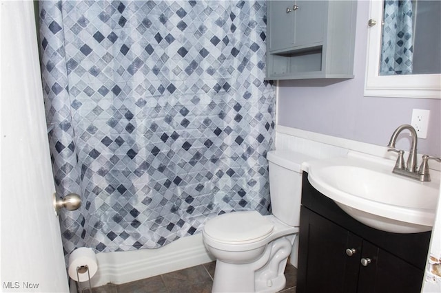 full bath featuring curtained shower, vanity, toilet, and tile patterned floors