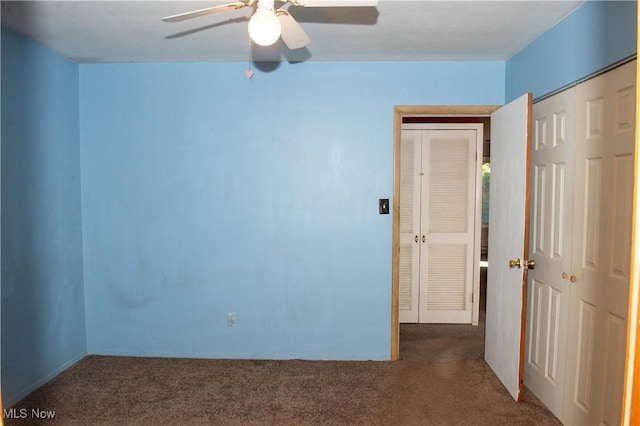 unfurnished bedroom featuring a closet, a ceiling fan, and carpet flooring