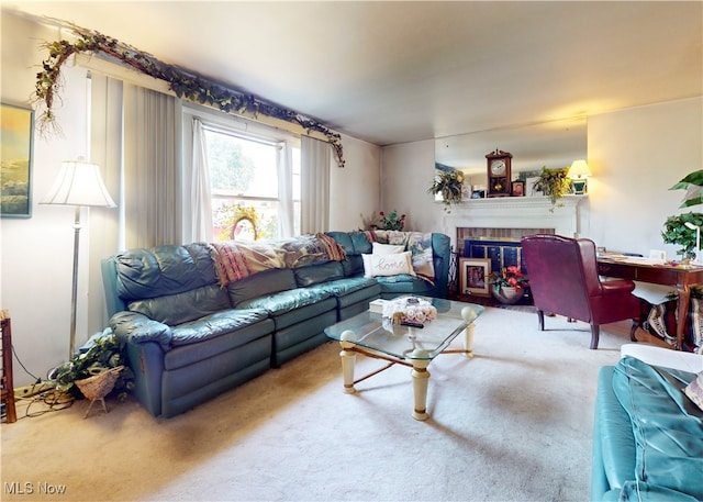 carpeted living room with a fireplace