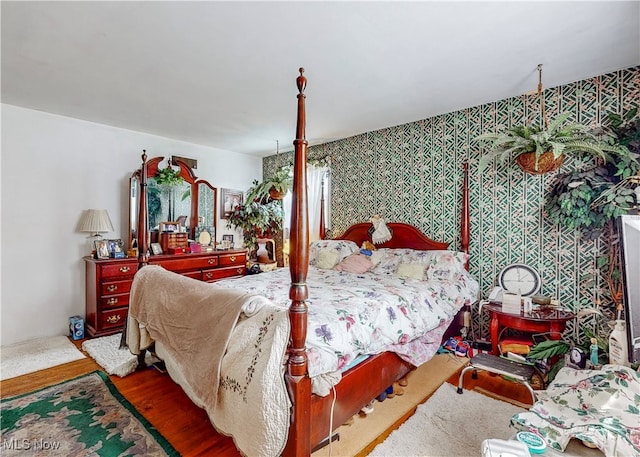 bedroom with hardwood / wood-style floors