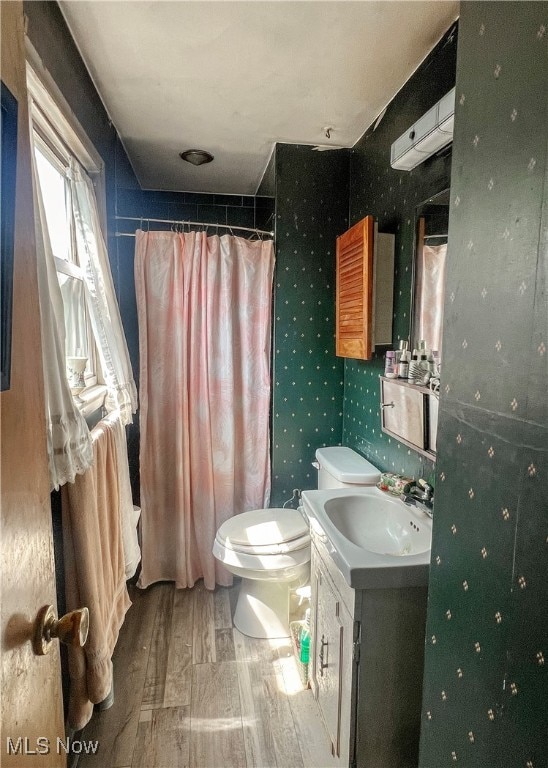 full bathroom featuring vanity, toilet, and separate shower and tub