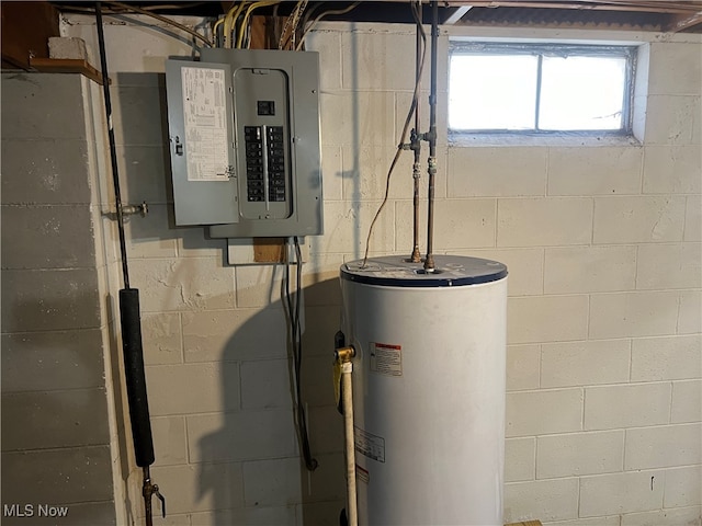 utility room featuring electric panel and water heater