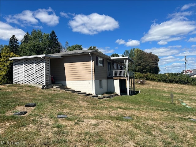 view of outbuilding with a yard