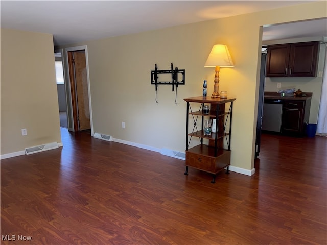 empty room with dark hardwood / wood-style flooring