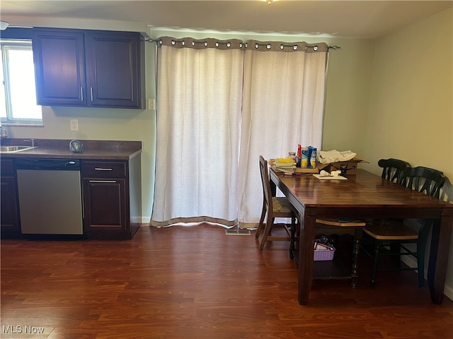 dining room featuring dark wood-type flooring and sink