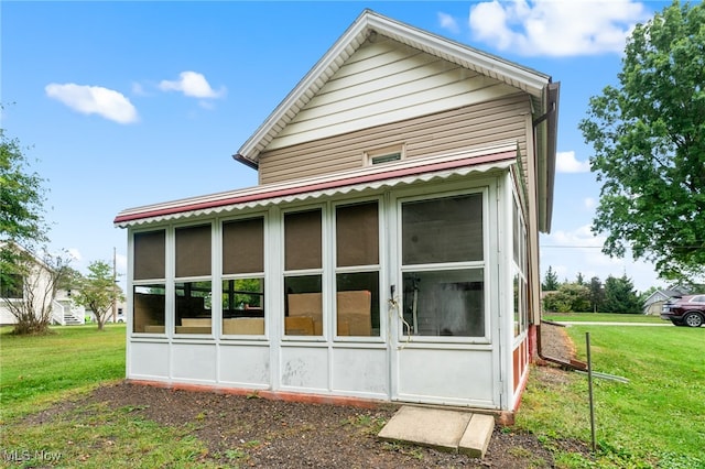 view of home's exterior featuring a yard