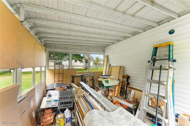 sunroom featuring lofted ceiling