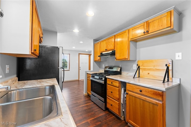 kitchen with sink, dark hardwood / wood-style floors, and appliances with stainless steel finishes