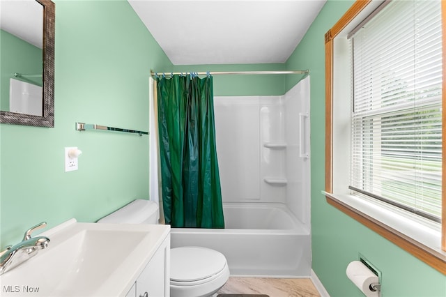 full bathroom with shower / bathtub combination with curtain, toilet, and vanity