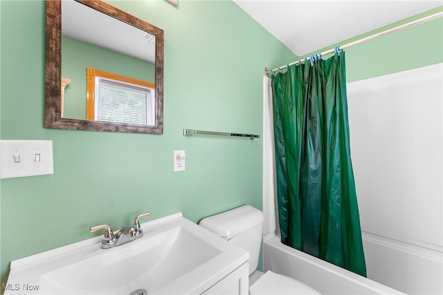 full bathroom with vanity, toilet, and shower / tub combo