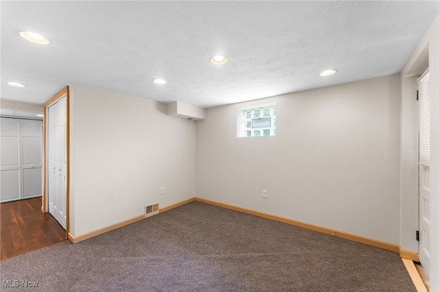 unfurnished bedroom featuring a closet, a textured ceiling, and carpet floors