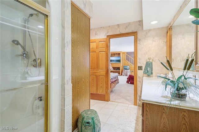 bathroom featuring a shower with shower door