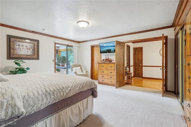 bedroom featuring crown molding, light colored carpet, and a textured ceiling