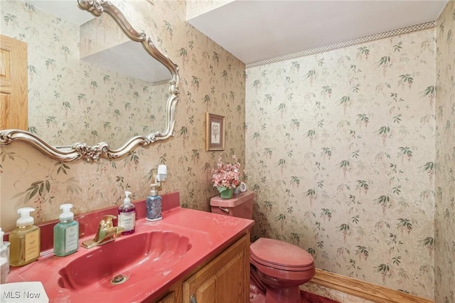 bathroom featuring vanity and toilet