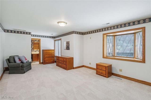 living area featuring light colored carpet