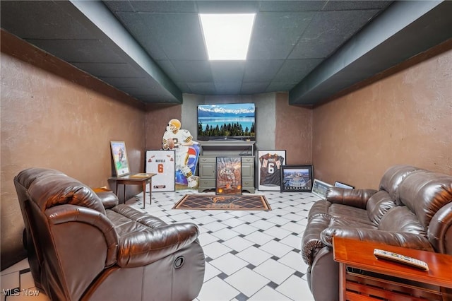 living room with a paneled ceiling