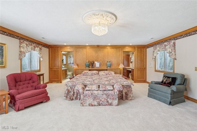 carpeted bedroom with ornamental molding, wooden walls, a chandelier, and multiple windows