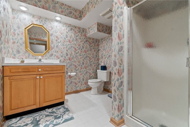 bathroom featuring toilet, tile patterned flooring, vanity, and walk in shower