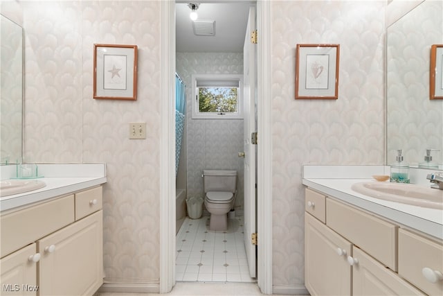 bathroom with tile patterned floors, vanity, a shower with shower curtain, and toilet