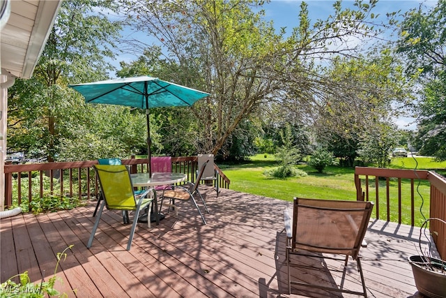 wooden deck with a lawn