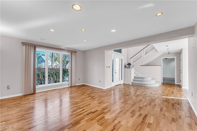 unfurnished living room with light hardwood / wood-style flooring