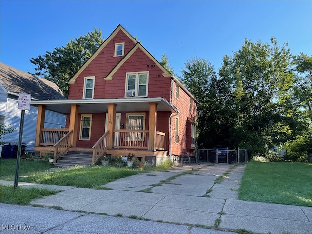 view of front facade featuring a front yard and a porch