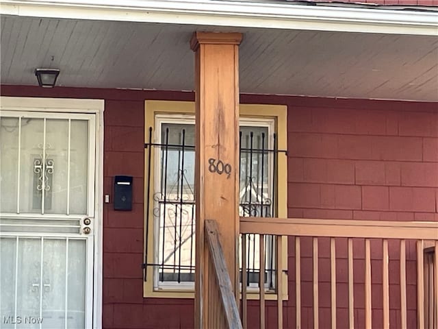 doorway to property featuring a porch