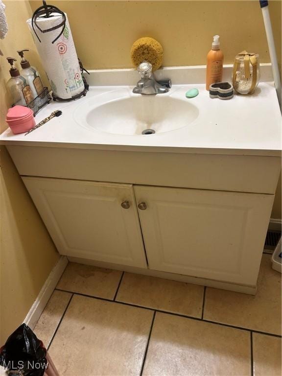 809 E 155th St, Cleveland, OH 44110 - bathroom featuring vanity and tile patterned flooring