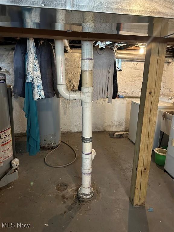809 E 155th St, Cleveland, OH 44110 - unfinished below grade area featuring washing machine and clothes dryer and water heater
