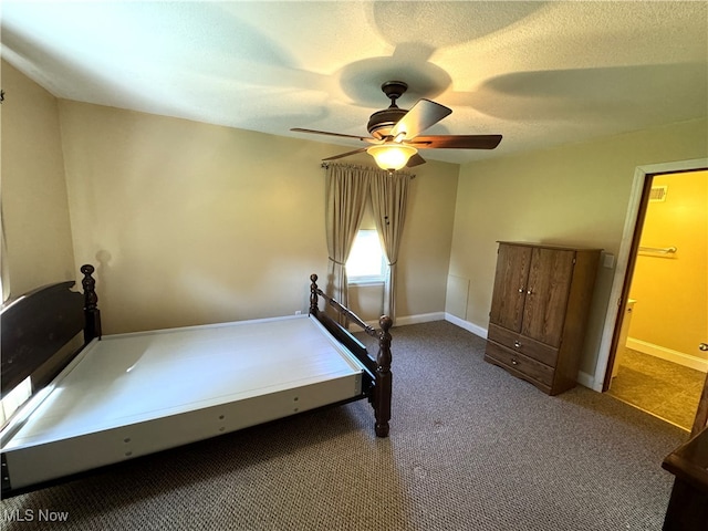 unfurnished bedroom with a textured ceiling, ceiling fan, and carpet floors