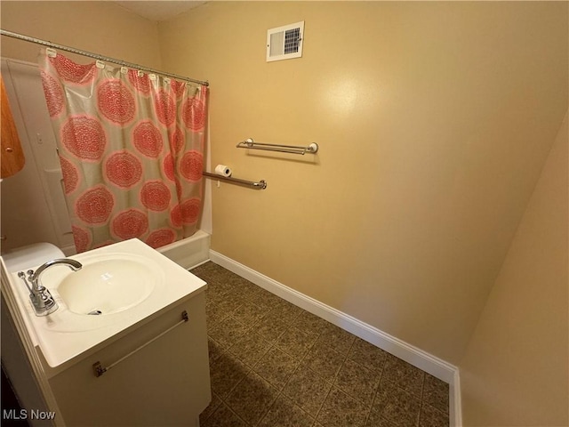 full bath featuring visible vents, vanity, baseboards, and tile patterned floors