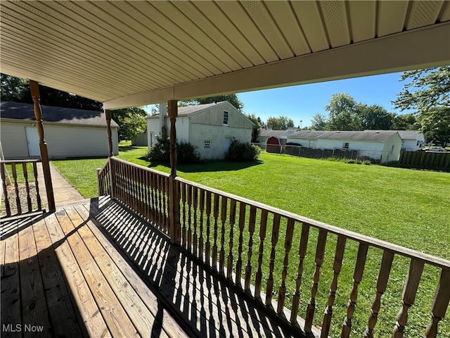 wooden deck featuring a yard