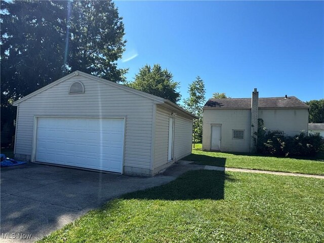 garage with a yard