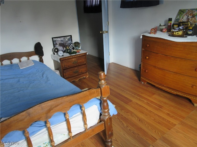 bedroom featuring wood-type flooring