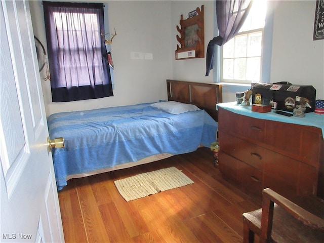 bedroom featuring dark hardwood / wood-style flooring