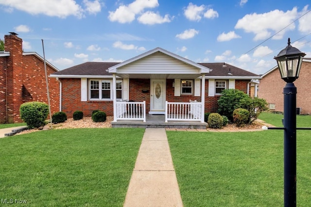 bungalow-style house with a front yard and a porch