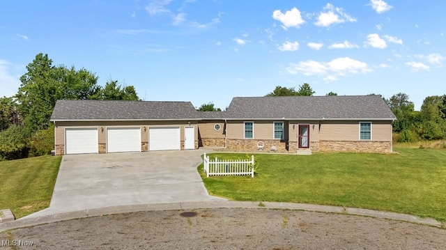 single story home with a garage and a front lawn