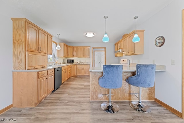 kitchen with light wood-type flooring, decorative light fixtures, stainless steel appliances, light brown cabinets, and kitchen peninsula